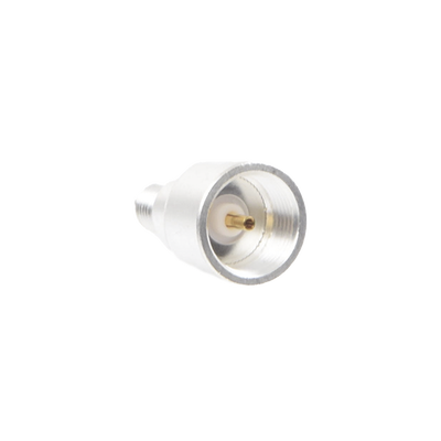 Adaptador UNIDAPT Hembra a SMA Hembra Inverso. Plata / Oro / Teflón.
